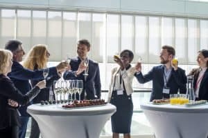 Cheerful business people toasting to success